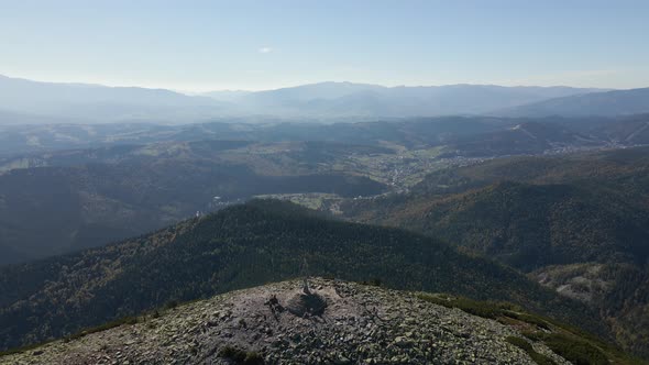 Aerial Landscape View of High Peaks with Dark Pine Forest Trees in Wild Mountains