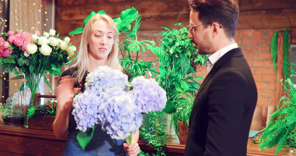 Florist Advises the Client in the Flower Shop  Advice to the Buyer