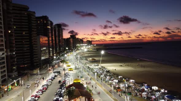 Colorful sunset sky at shore avenue of downtown Fortaleza, state of Ceara, Brazil.
