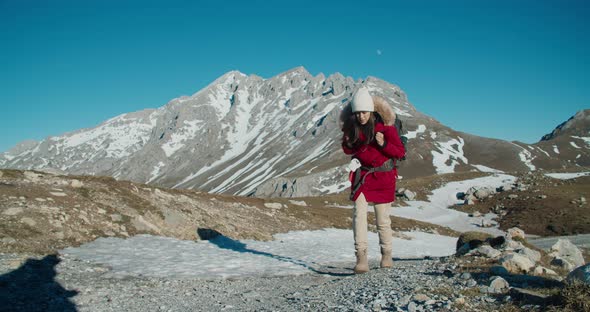 Young Adult Traveler Woman Climbing Up on Mountain Road