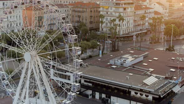 Cannes Port and a Ferris Wheel at Sunrise