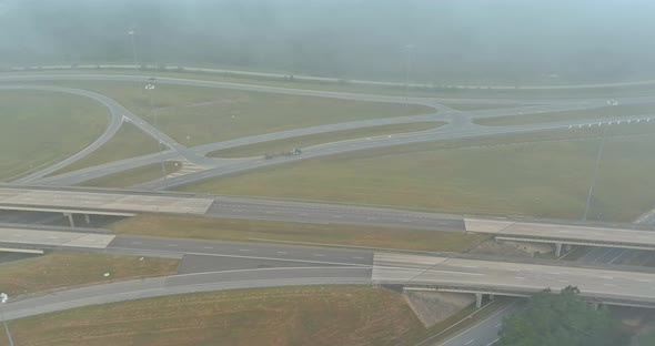 Misty Morning Over a Desolate Country Road with Bridge Across US 65 Highway Near Satsuma Alabama