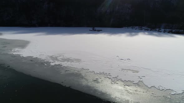 River in Winter with Sun Reflection 4K