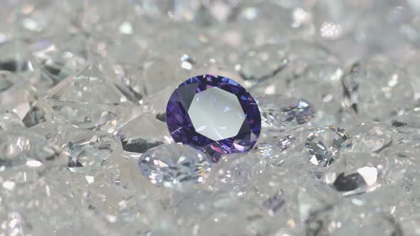 Purple Diamond On A Pile Of White Diamonds.
