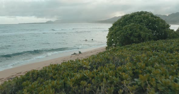 4k aerial flight over ocean at sunset in Hawaii.