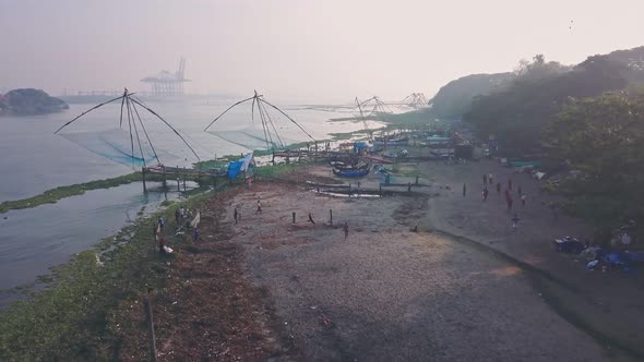 Traditional Chinese fishing nets at Fort Kochi, India. Aerial drone view at sunrise
