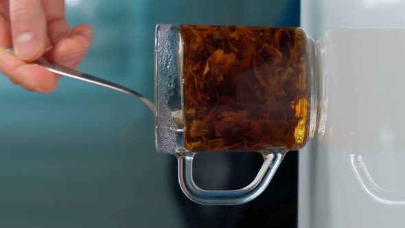 Dry Tea Leaves in Water Closeup