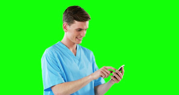 Male doctor using mobile phone