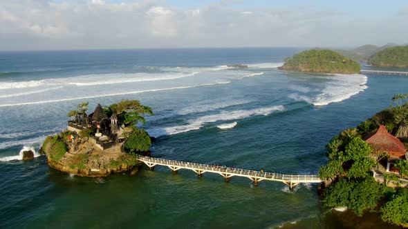 Picturesque Balekambang Hindu Temple on rocky island on Java coast, aerial view