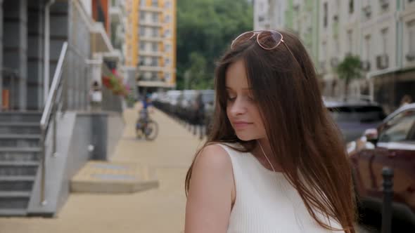 Girl with Headphones Is Dancing