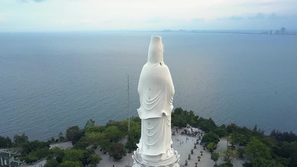 Upper Round Motion Huge White Buddha Statue on Ocean Coast