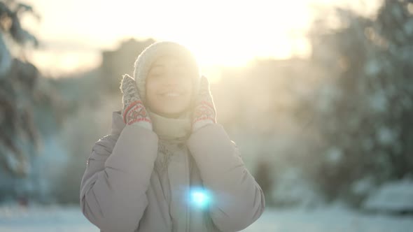 Slow Motion Cheerful Beautiful Woman Walking in Winter Park After Snowfall