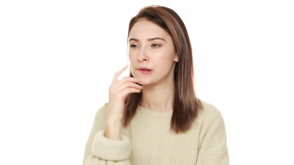 Portrait of Adult Woman with Brown Hair Being Deep in Thoughts Doing Pensive Gesture Trying to