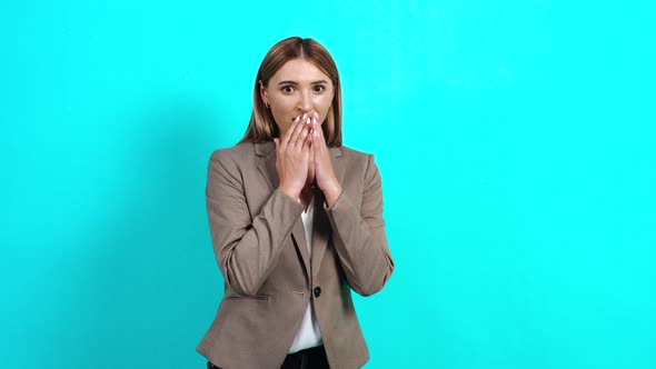 Portrait of a Woman with Astonished Brown Hair, Excited, in a Business-style Jacket