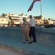 American Flag Stock Video Footage - An Old Couple Walking On The Bridge Sidewalk - VideoHive Item for Sale
