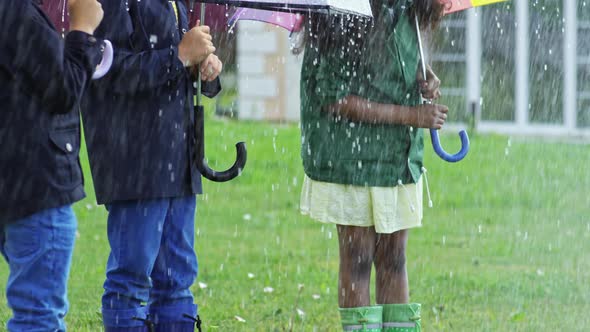 Children Laughing in Heavy Rain