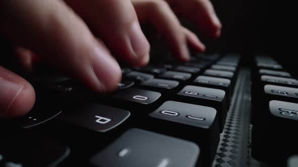 Closeup Typing on Keyboard with Man Fingers