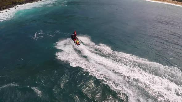 Aerial view of lifeguard surf rescue jetski personal watercraft in Hawaii.