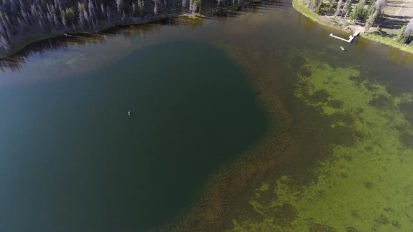 Aerial view of single boat in middle of lake