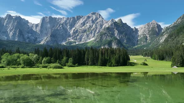 Emerald lake at Fusine with Mangart mountain