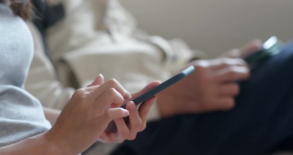 Woman use of mobile phone at home