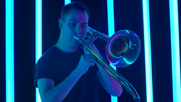 A Talented Musician Performing a Wonderful Song on a Wind Instrument in a Studio Surrounded By