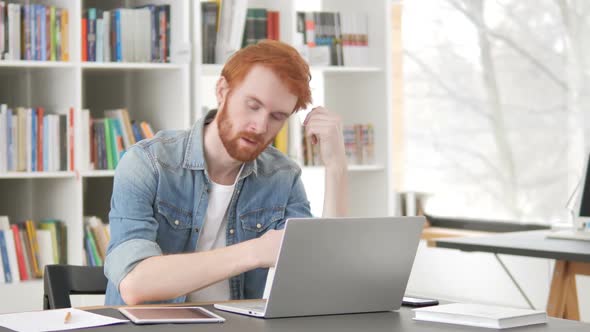 Tired Casual Redhead Man Sleeping at Work