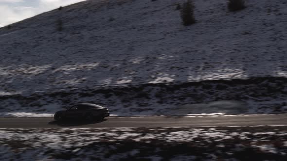 Car in the Mountains of the Caucasus in Winter