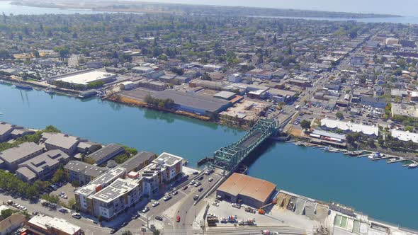 Aerial capture of Park Street Bridge in time lapse. Tidal Canal in Oakland.