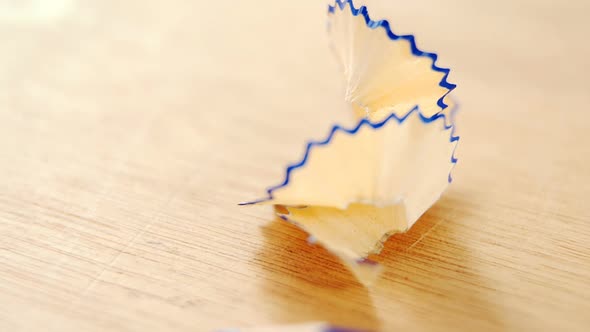 Close-up of blue colored pencil with shavings