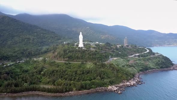 Aerial View Green Hill with Buddhist Complex on Ocean Coast