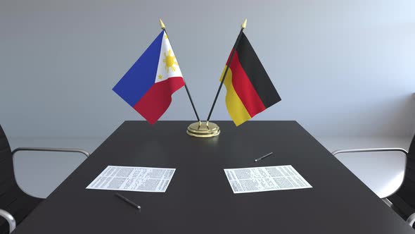 Flags of the Philippines and Germany and Papers