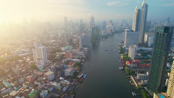 4K : Drones fly over the Chao Phraya River, buildings and business districts