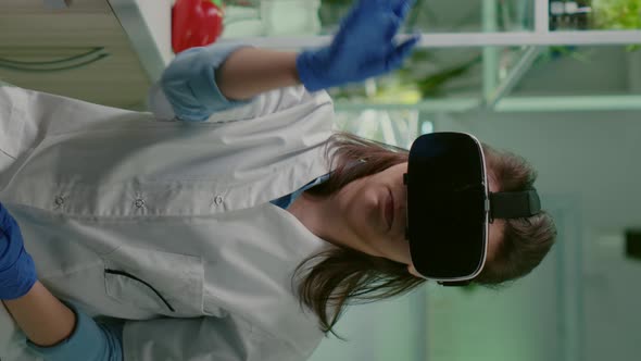 Vertical Video Scientist Woman Researcher Wearing Virtual Reality Headset