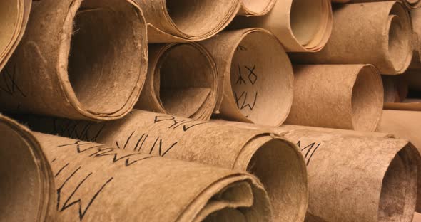 Scrolls stacked on a pile. Medieval manuscripts library.