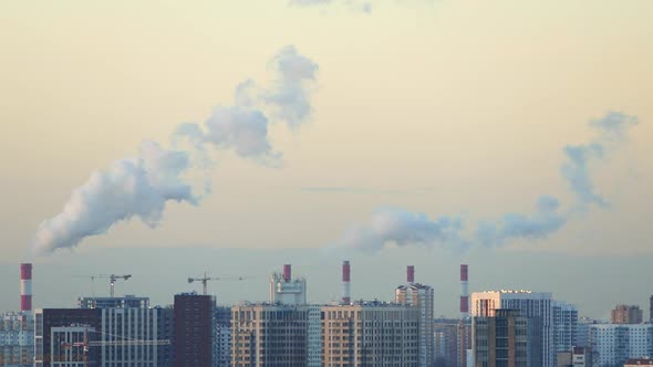 City skyline with smoking plant chimneys, stock video