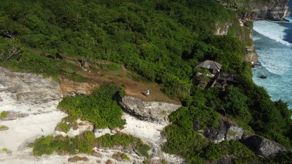 Man Stays on the Clifftop Above Ocean