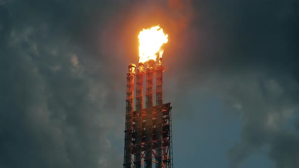 Pipes of the Petroleum Refinery with Flame Going Out of Them