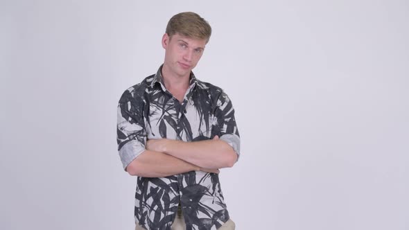 Young Handsome Tourist Man with Arms Crossed