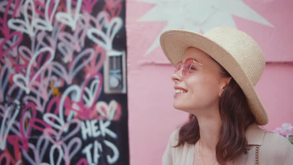 Smiling girl on a background of graffiti