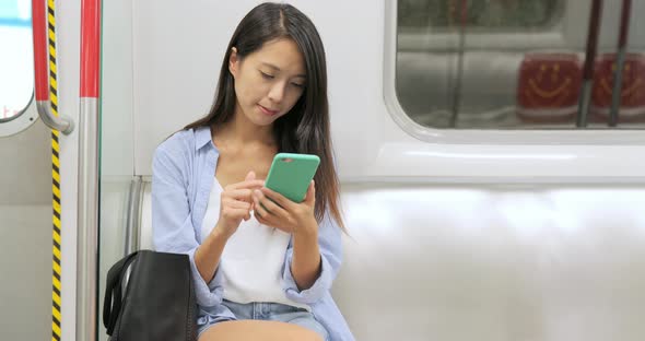 Woman Use of Mobile Phone on Train 