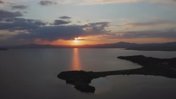 Beautiful Sunset Over the Mountain Range on the Horizon to the Sea