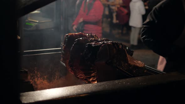 Big Piece of Meat Coocked on Open Fire and Some Pork Pieces Grilled at Historical Medieval Festival