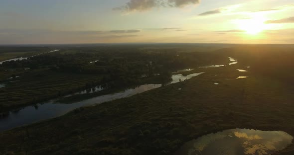 Aerial Sunset Scene of Wood and Wetlands