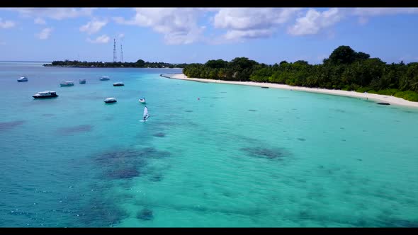 Aerial above scenery of tranquil seashore beach trip by blue sea with white sand background of a day