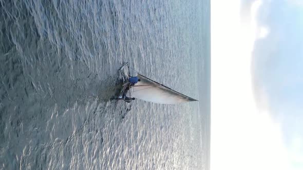 Vertical Video Boats in the Ocean Near the Coast of Zanzibar Tanzania Aerial View