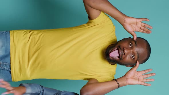 Vertical Video Man and Woman Sticking Tongue Out and Fooling Around in Front of Camera