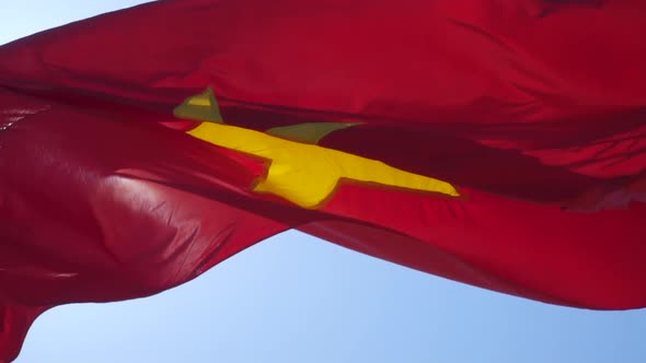 Vietnamese Flag Against Blue Sky. Slow Motion. 