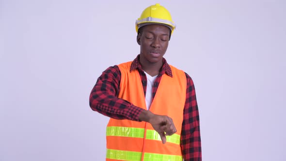 Young Stressed African Man Construction Worker Giving Thumbs Down