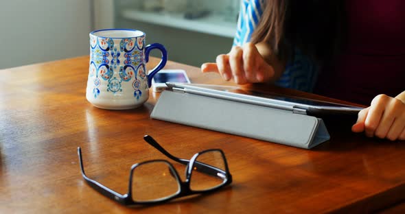 Woman using digital tablet